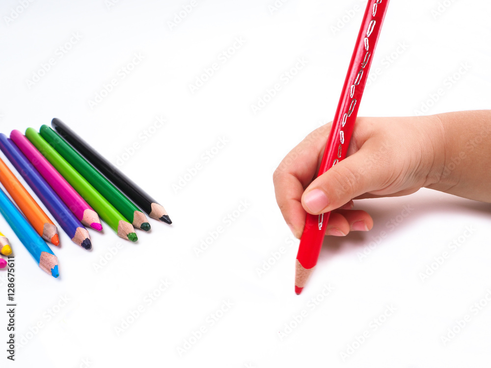Naklejka premium Girl draws with colored pencils