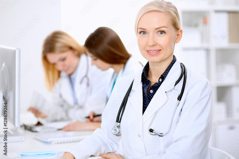Female doctor leading a medical team at the hospital Female doctor leading a medical team at the hospital