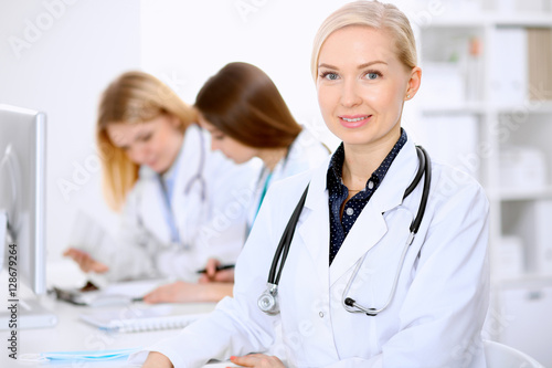 Female doctor leading a medical team at the hospital