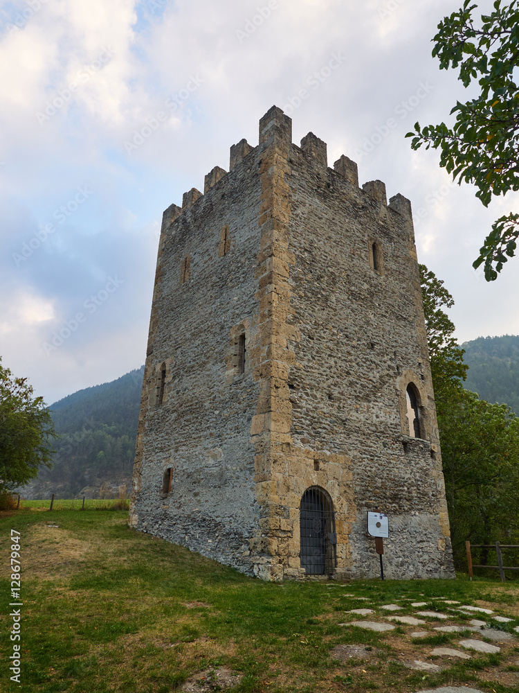 Oulx, Italy _ October 03, 2016 Medieval square crenellated tower called Oulx, Italy _ October 03, 2016 Medieval square crenellated tower called