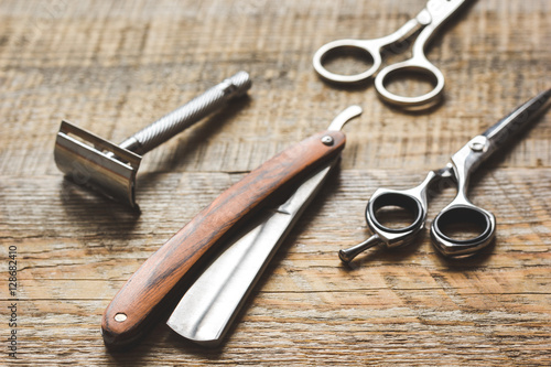 Tools for cutting beard barbershop on wooden background