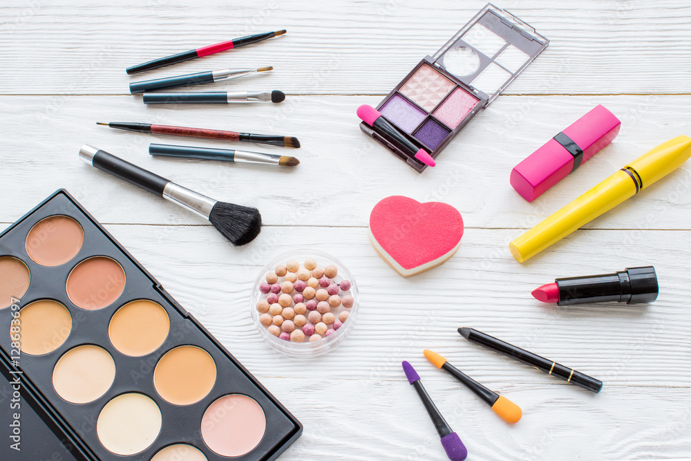 set of decorative cosmetics on wooden background top view set of decorative cosmetics on wooden background top view