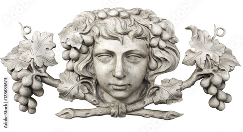 Face and grapes carved in marble isolated on white