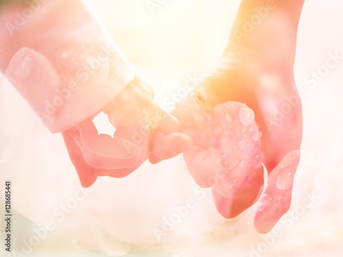 Happy couple holding hands together as forever love with Vintage filter, Valentine day background.