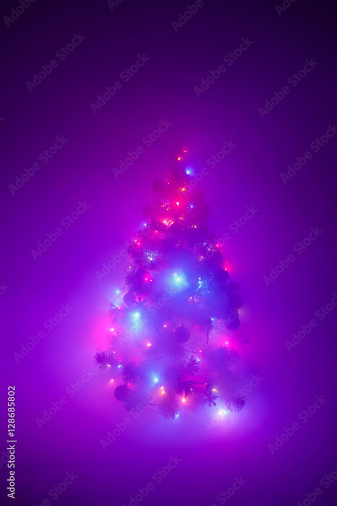 Christmas tree lights garland in frozen mist Christmas tree lights garland in frozen mist