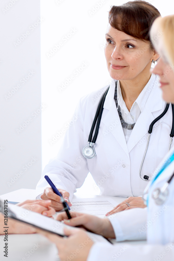 Doctor and patient at meeting. Medicine and health care concept. Doctor and patient at meeting. Medicine and health care concept.