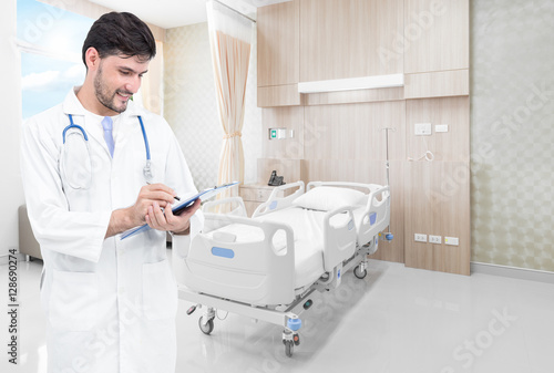 Doctor writing medical records in modern hospital room