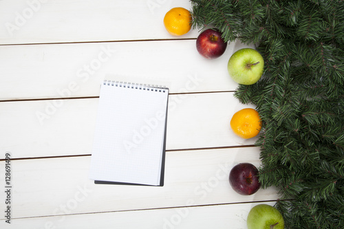 Notebook, fruit and spruce