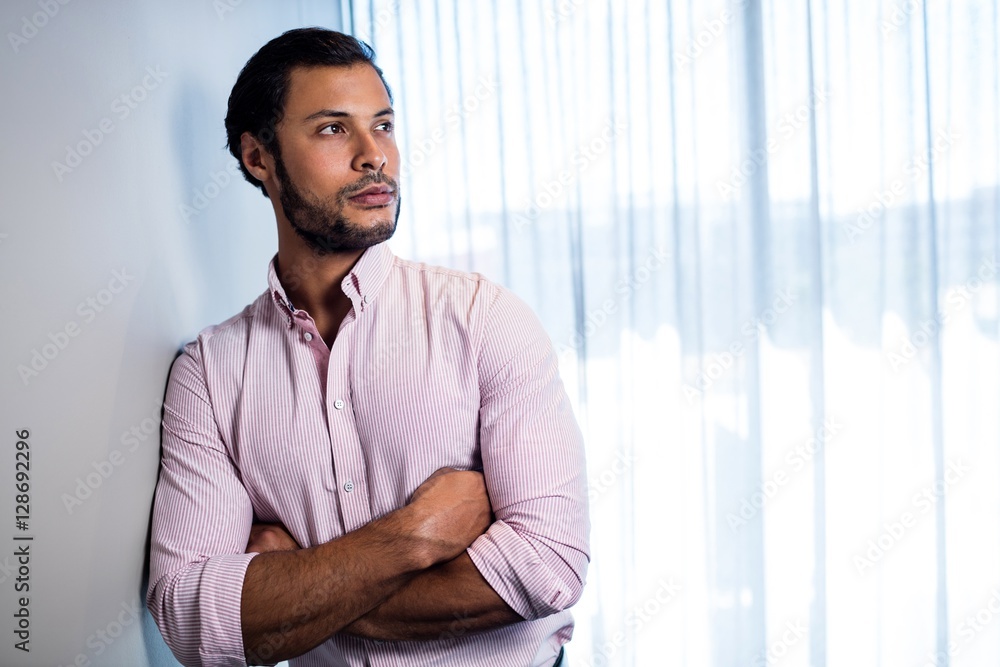 Handsome businessman looking away while posing Handsome businessman looking away while posing