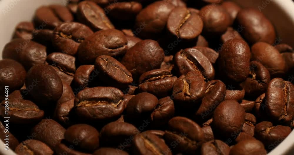 Close up of falling coffee beans Close up of falling coffee beans