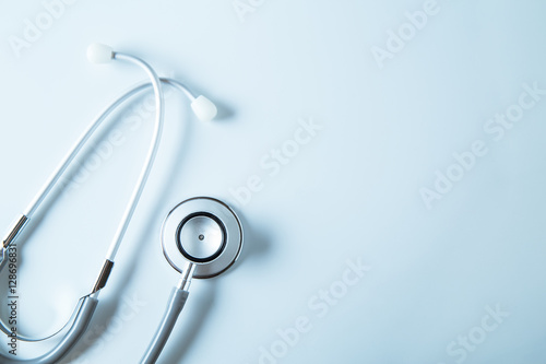 Stethoscope on blue background