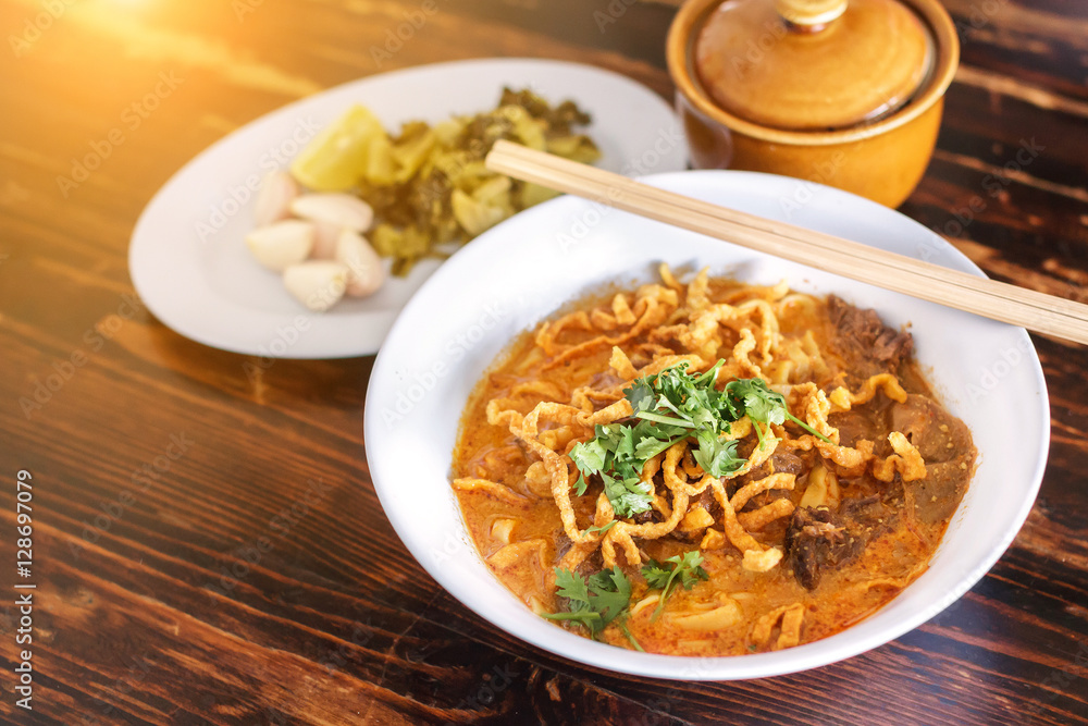 Curried Noodle Soup (Khao soi) with spicy coconut milk. Noodle Soup with beef. Curried noodle soup. Noodle Thai cuisine northern style. Khao Soi Recipe. Thai food. Curried Noodle Soup (Khao soi) with spicy coconut milk. Noodle Soup with beef. Curried noodle soup. Noodle Thai cuisine northern style. Khao Soi Recipe. Thai food.
