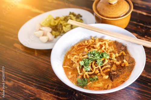 Curried Noodle Soup (Khao soi) with spicy coconut milk. Noodle Soup with beef. Curried noodle soup. Noodle Thai cuisine northern style. Khao Soi Recipe. Thai food.