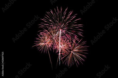 Colorful new year fireworks over dark sky