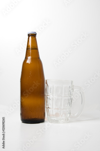 Brown beer bottle With empty beer glass