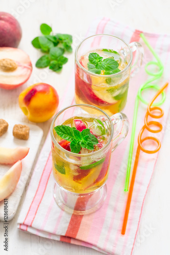 Cold peach tea with mint. Refreshing summer drink