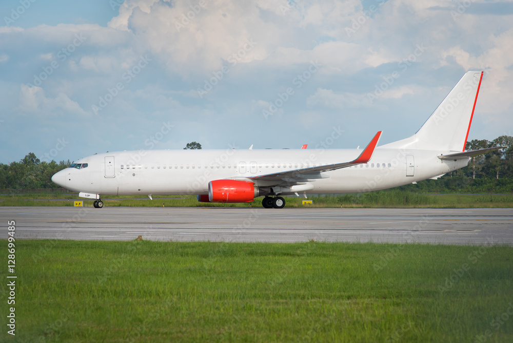 white passenger jet plane on runway at the airport on a sunny da