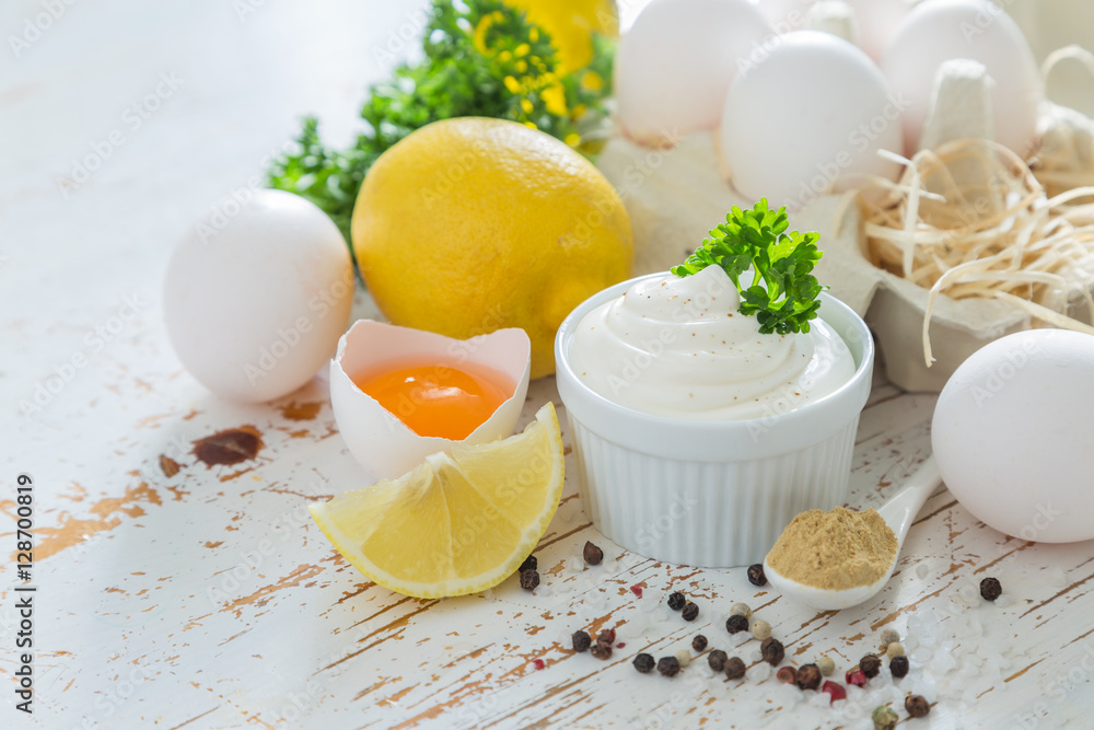 Mayonnaise sauce and ingredients on wood background Mayonnaise sauce and ingredients on wood background
