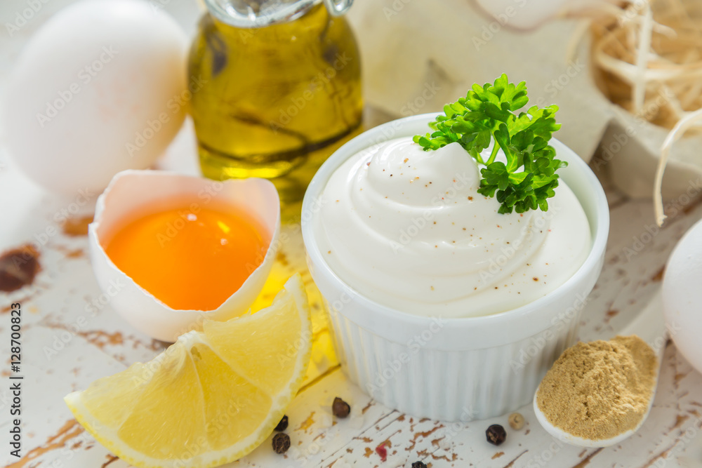Mayonnaise sauce and ingredients on wood background Mayonnaise sauce and ingredients on wood background