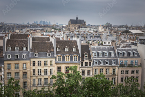 Photography Paris aerial cityscape view of historical apartment buildings and Paroisse Saint-Eustache cathedral or the Church of Saint Eustache