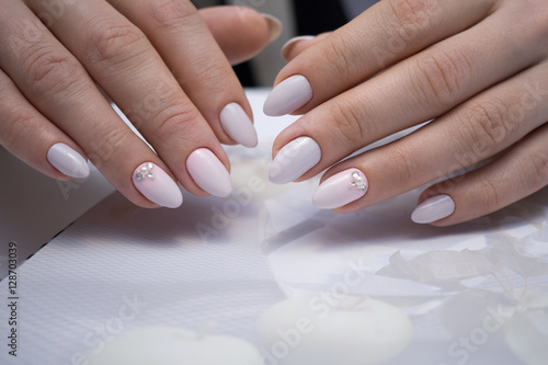The beauty of the natural nails. Perfect clean manicure for the bright people. Nail drill machine and cuticle nipper are used simultaneously to make such a clean manicure.