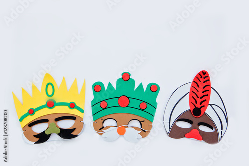 Christmas,the three kings of orient.The three wise men mask in yellow background