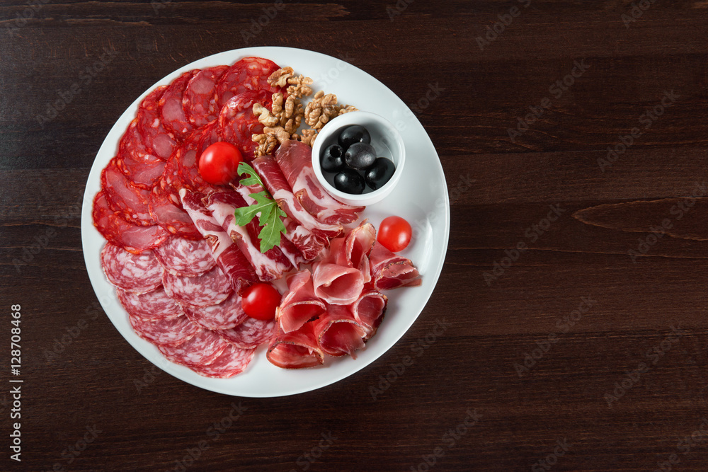 Assorted cold meat deli plate at the restaurant Assorted cold meat deli plate at the restaurant