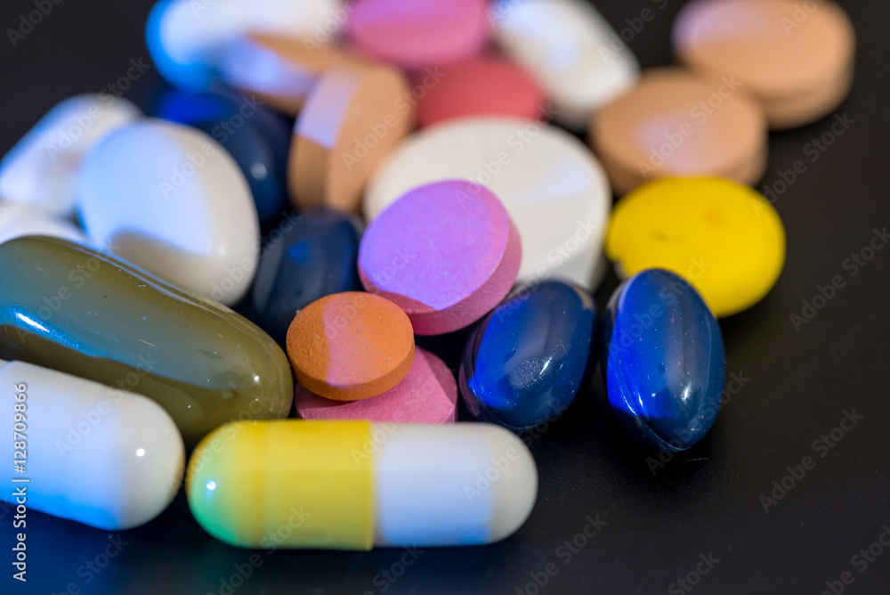 Pharmacy background - pills isolatedon a black Pharmacy background - pills isolatedon a black