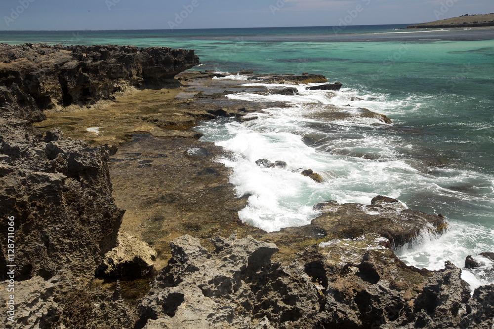 Bay Amoronia Indian Ocean, Orange cove is lined with sharp rocks, north of Madagascar