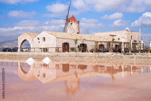 View of windmill in the salt pans, Trapani. Sicily - August 2016