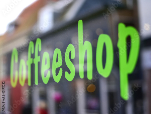 Coffeeshop sticker at a shop window, Amsterdam culture.