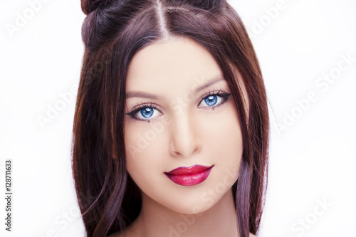 Young  beautiful woman with bright makeup on white background