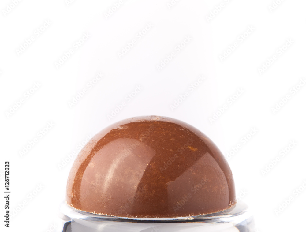 Obraz premium One chocolate candy on a light background