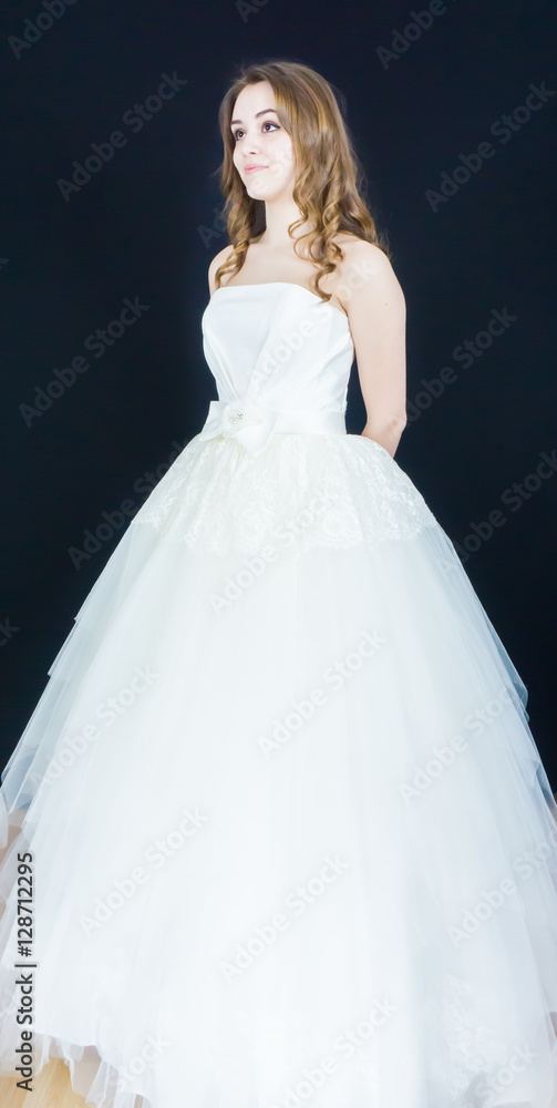 Fototapeta premium bride on black background. dress