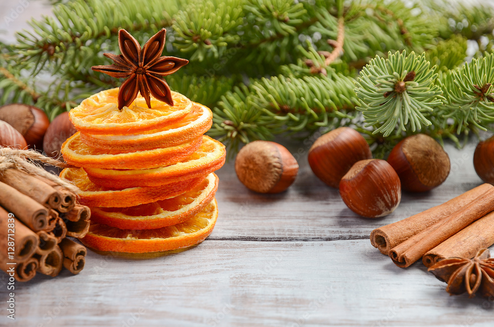 Christmas background with Fir Branches, Nuts, Spices and Dried oranges. Christmas background with Fir Branches, Nuts, Spices and Dried oranges.