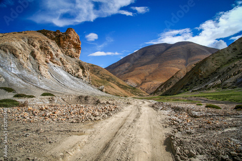 Dirt gravel mountain road through central Tibet