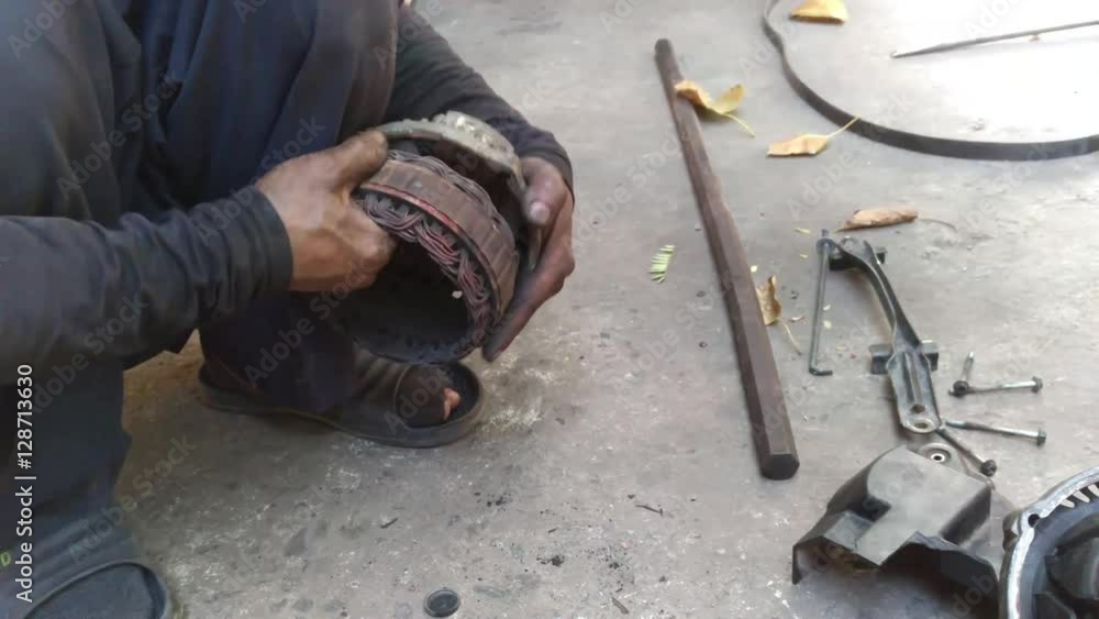 professional automotive motor mechanic repair and inspecting the alternator professional automotive motor mechanic repair and inspecting the alternator