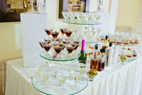 Glasses with vermouth and drinks on wedding reception