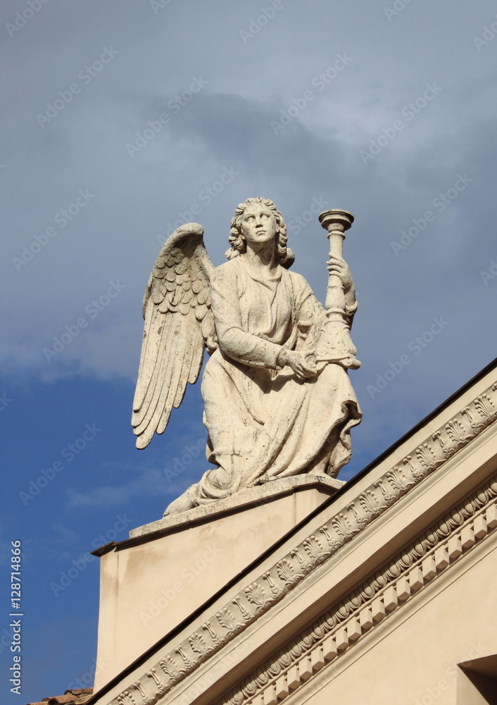 Angel statue with candelabra