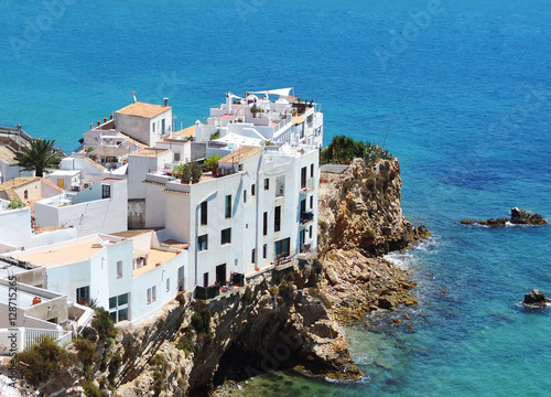 Houses built on a cliff coast, Ibiza Island. © eivaisla