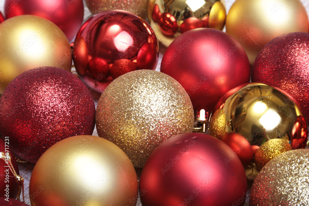 Red and gold christmas balls on a wooden background Red and gold christmas balls on a wooden background