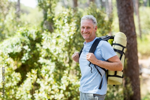 Man smiling and hiking 