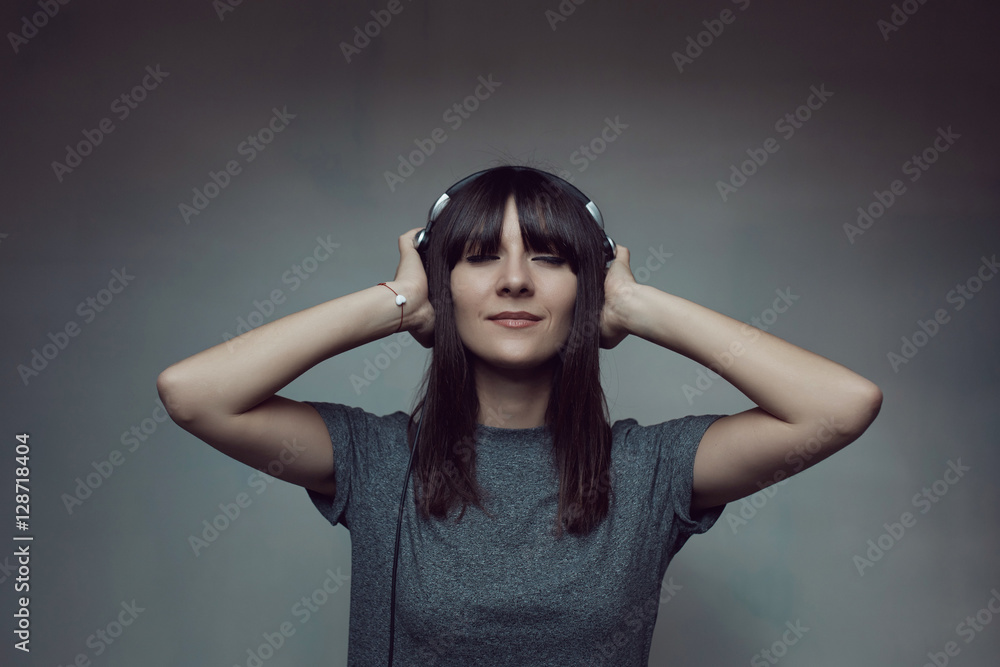 Pretty brunette woman posing in light room Pretty brunette woman posing in light room