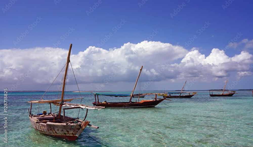 Traditional fishing boat standing on the shore in the clear water of the Indian Ocean. island of Madagascar