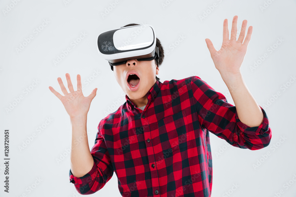 Man wearing virtual reality device and gesturing with hands Man wearing virtual reality device and gesturing with hands