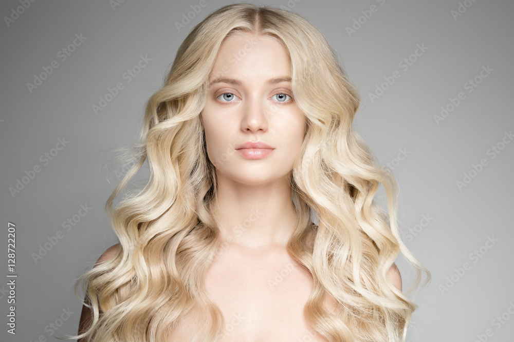 Portrait Of A Beautiful Young Blond Woman With Long Wavy Hair. Portrait Of A Beautiful Young Blond Woman With Long Wavy Hair.