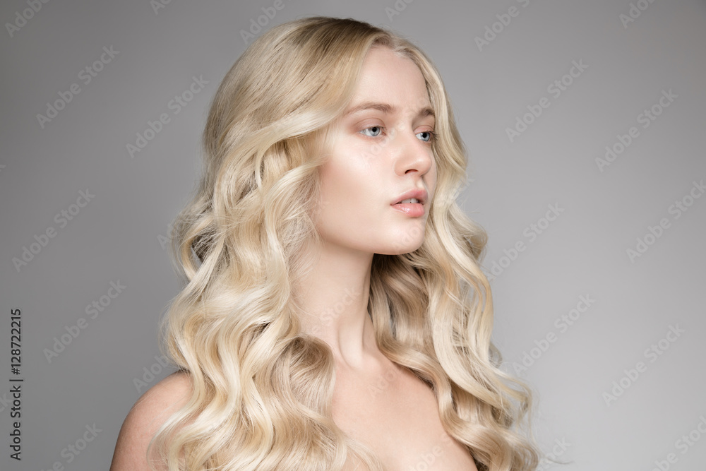 Portrait Of A Beautiful Young Blond Woman With Long Wavy Hair. Portrait Of A Beautiful Young Blond Woman With Long Wavy Hair.