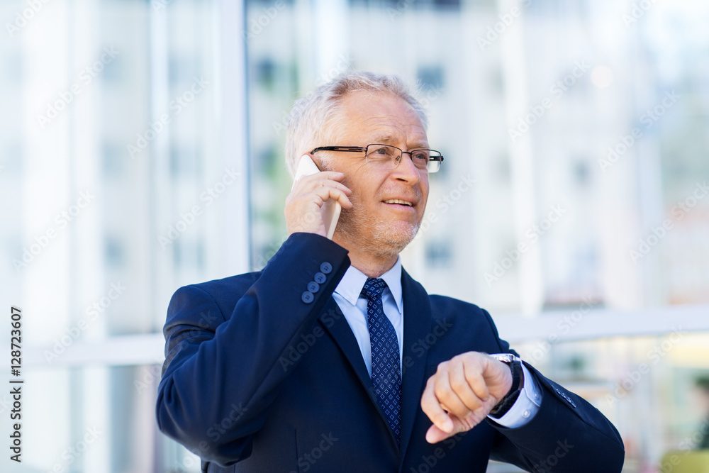 senior businessman calling on smartphone in city senior businessman calling on smartphone in city