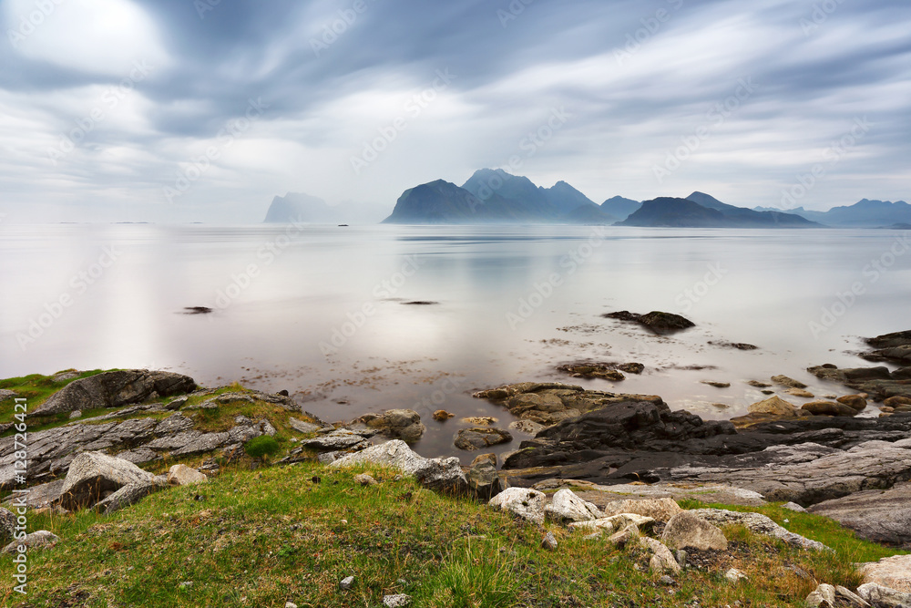Summer cloudy Lofoten islands. Norway misty fjords.
