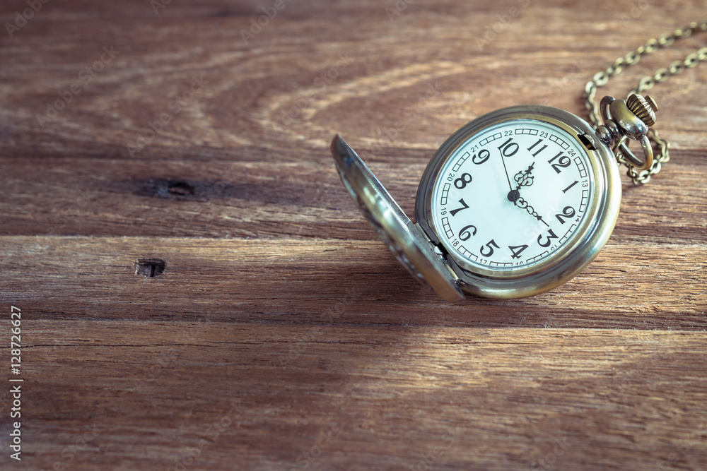 Pocket watch on wooden background Pocket watch on wooden background
